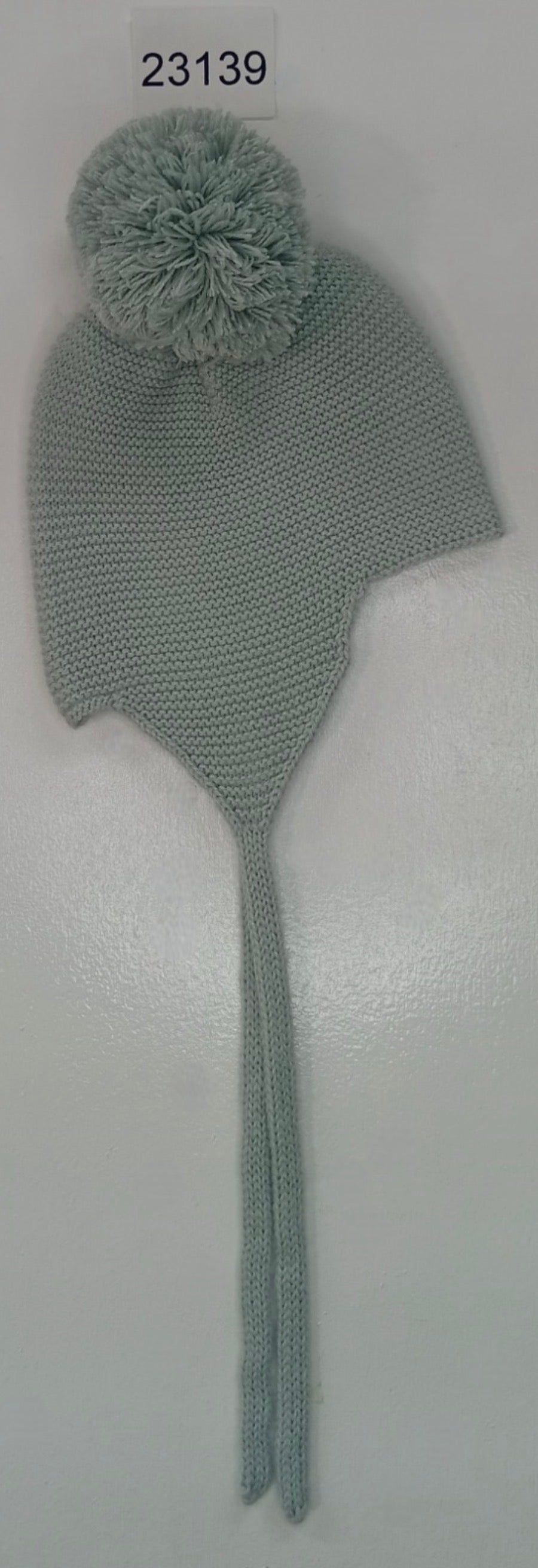Capota lana verde pompón